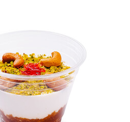 Popular dessert with creamy yogurt and crunchy toppings served in a cup