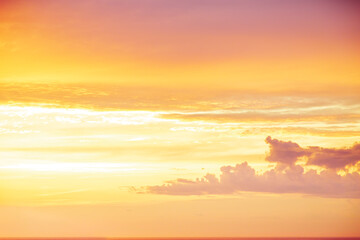 Beautiful sunset orange sky with fluffy clouds.