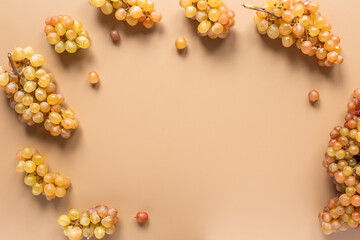 Many bunches of ripe yellow grapes, top view