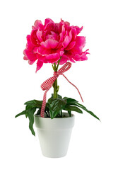 A detailed studio shot of a lush artificial pink flower in a white pot on a transparent background