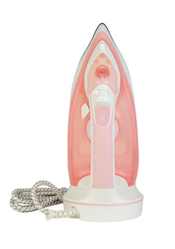 A detailed studio shot of a modern pink and white cordless steam iron resting on its charging base, isolated on a transparent  background