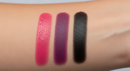 Swatches of Pink, Purple, and Black Cosmetic Pigments on Skin
