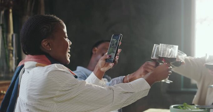 Happy people, wine glass or phone with picture for dining celebration, social media or get together. Group, toast or cheers with alcohol, mobile smartphone or capture moment for memory in restaurant
