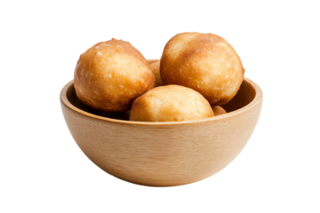 Delicious golden brown fried dough balls in a wooden bowl, perfect for snacks or desserts.