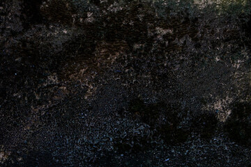 Dark, Textured Surface with Organic Details