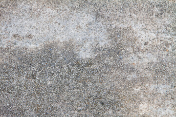 Close-up of a textured, weathered concrete surface showing detail.