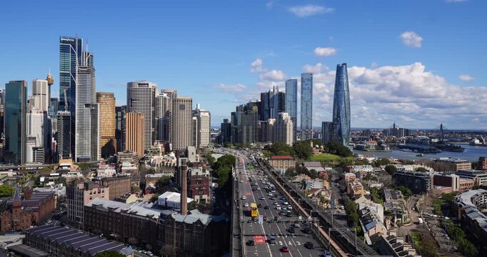 Sydney, Australia - August 24 2025: Time lapse of the traffic on the Cahill expressway on the Sydney harbor bridge with skyline in the background in Australia largest city. 
