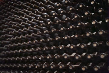 Fototapeta premium wine bottles in wine cellar warehouse background