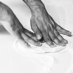 Fototapeta premium Making pizza dough on board with flour