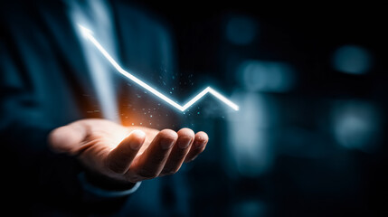 A hand interacts with a glowing, spark-filled data chart, symbolizing the power of data visualization and analytics in understanding trends and driving business decisions.