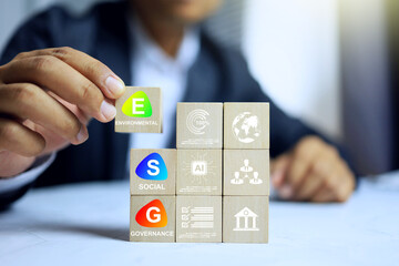 ESG environmental social governance concept with businessman arrange wooden block represent to...