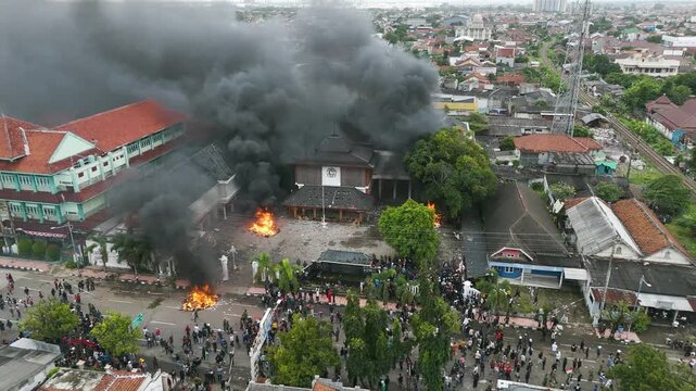 High aerial drone video shows the DPRD Cilacap building on fire amid protests on August 30, 2025, in Cilacap, Central Java, Indonesia.