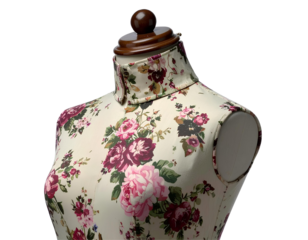 Vintage floral mannequin with adjustable wooden neck and fabric details, side angle view, isolated on a transparent background, PNG