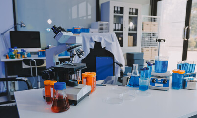 Collaboration, tablet or science with people in lab together for research or development. Innovation, tech and microscope with scientist team in clinical trial for planning or medical investigation