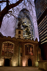 church at night and modern buildings