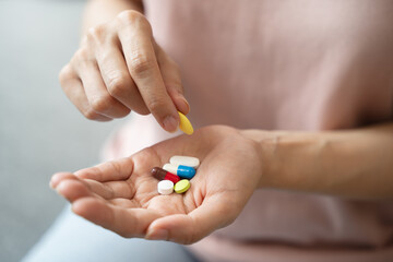 Healthcare Harmony: Close-Up Hands Holding Medication and Water Glass for Optimal Wellness, Pharmaceutical Treatment and mental health treatment