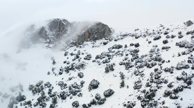 Aerial view of heavy snowfall over the mountains of the village of Castell de Castells in the province of Alicante, Spain.