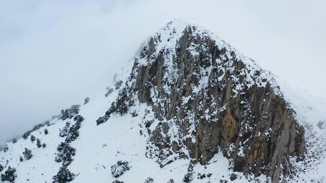 Aerial view of heavy snowfall over the mountains of the village of Castell de Castells in the province of Alicante, Spain.