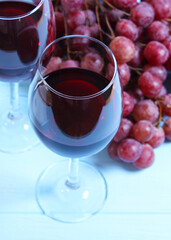 red wine and grapes on the table top view.. Vertical photo format