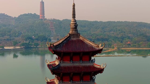 Scenic view of Ninh Binh with pagodas and lush greenery under blue sky.