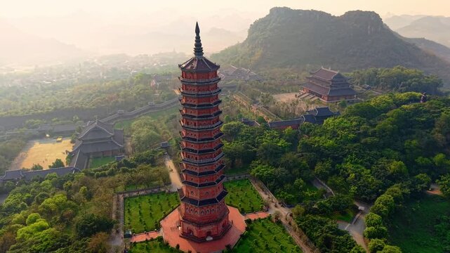 Aerial view of bai dinh pagoda and mountains at sunset in Ninh Binh, Vietnam.