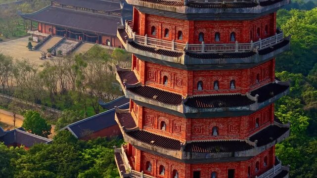 Ancient brick pagoda tower in scenic Ninh Binh, Vietnam at sunrise.