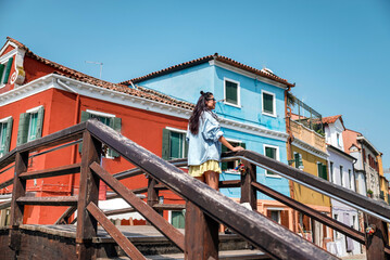 Beautiful  traveler woman on the street in Burano island  ,Italy 