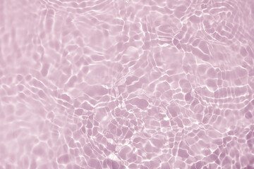 Soft focus lite purple pink rose cosmetic moisturizer floral water, micellar toner, or emulsion abstract background. Reflections of  scattered sun texture.