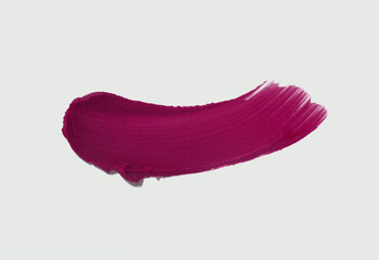 Cosmetic make-up beauty product. Matte dark burgundy claret maroon lipstick swatch isolated on...