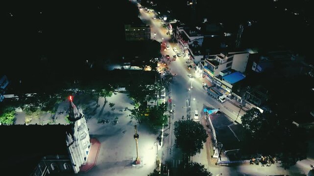 High-angle night view of Vetturnimadam neighborhood with glowing gates and roads