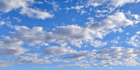 Obraz premium Calm autumn sky with fluffy clouds drifting through a clear blue expanse