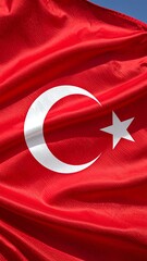 Obraz premium Close-up view of a vibrant Turkish flag, showcasing the intricate folds and texture of the fabric.