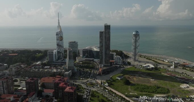 Aerial view of the Alphabet Tower and Radisson Blu Hotel in Batumi, where modern architecture meets the tranquil Black Sea, creating a captivating skyline, Batumi, Adjara, Georgia.