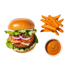 Juicy gourmet burger with crispy sweet potato fries and creamy dipping sauce overhead shot