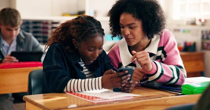 Cellphone, laughing and students in classroom at school with networking, social media or mobile app. Technology, funny and girl teenagers with phone for online contact with comic joke at academy.