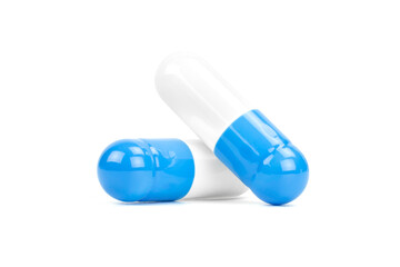 Two blue and white medicine capsules pill for medical dosage and healthcare treatment, isolated on white background with clipping path.