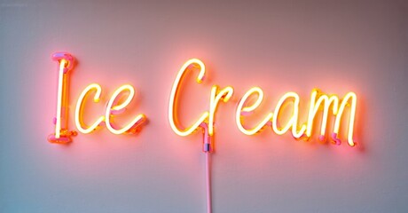 Bright neon sign spells Ice Cream. Pink wall provides soft backdrop. Simple design, inviting aesthetic. Warm glow radiates.