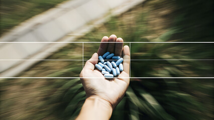 Closeup of blue pills in and representing medicine and addiction concept