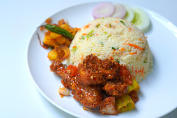 Fried Rice Combination with Spicy Devil Chicken and Crisp Veggies.