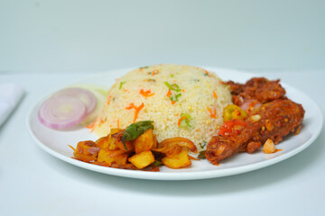 Spicy Devil Chicken with Fried Rice, Onion Slices, and Cucumber Garnish.