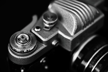 film retro camera on black background