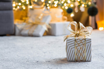 A cozy concept for the Christmas holidays of 2026. Stylish gift boxes, toys, and a Christmas tree...