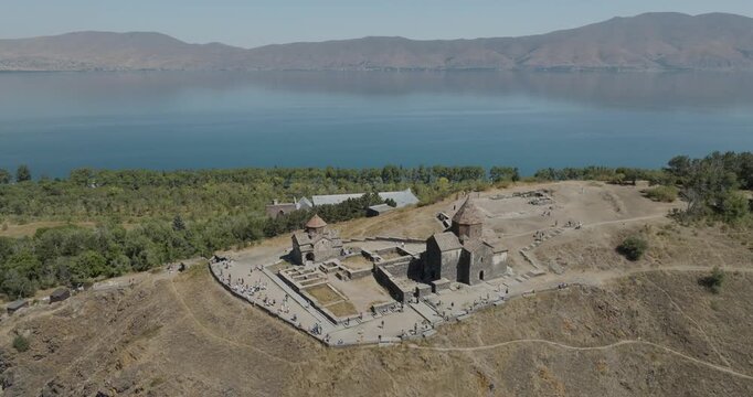 Aerial view of Sevanavank Monastery, a stunning medieval complex overlooking Lake Sevan with blue waters and green trees, Lake Sevan, Gegharkunik Province, Armenia.
