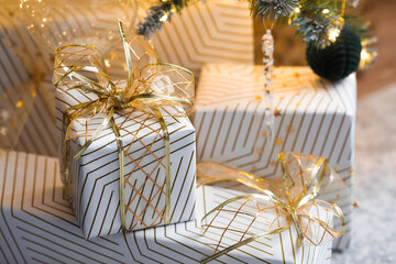 New Year's Eve, cozy concept for the Christmas holidays Stylish gift boxes on the background of a...
