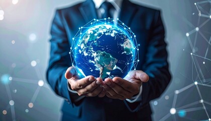 Businessperson in suit holding illuminated digital globe with network lines and nodes against dark tech background