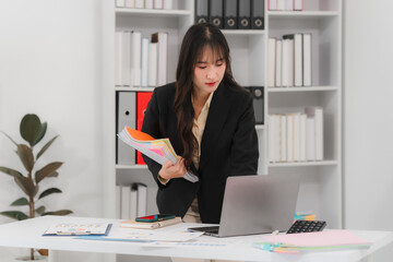 Focused Asian Businesswoman Working in Office