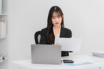 Asian Businesswoman Working at Desk