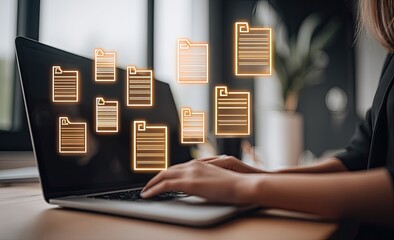 Person using laptop with floating document icons