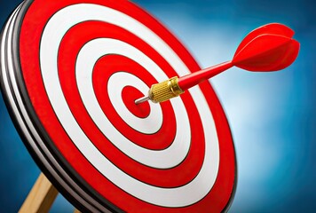 Red dart embedded in the bullseye of a target