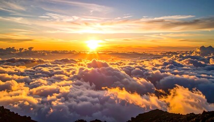 A breathtaking sunset view from above, showcasing a golden sun sinking below a vast expanse of clouds.